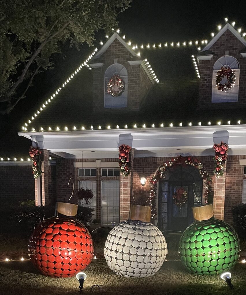 House decorated for Christmas with lights, wreaths and decor. Large ball ornaments you can get at estate sale as Christmas decor 