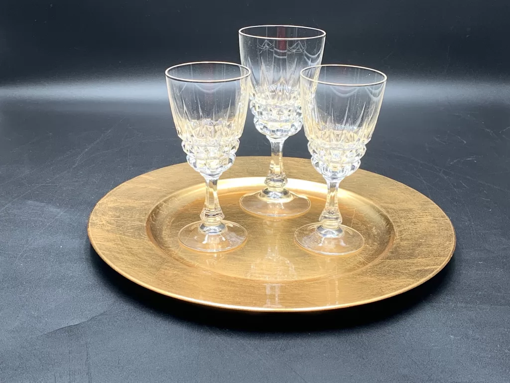 crystal vintage stemware three wine glasses on a gold charger for a vintage Thanksgiving table decor