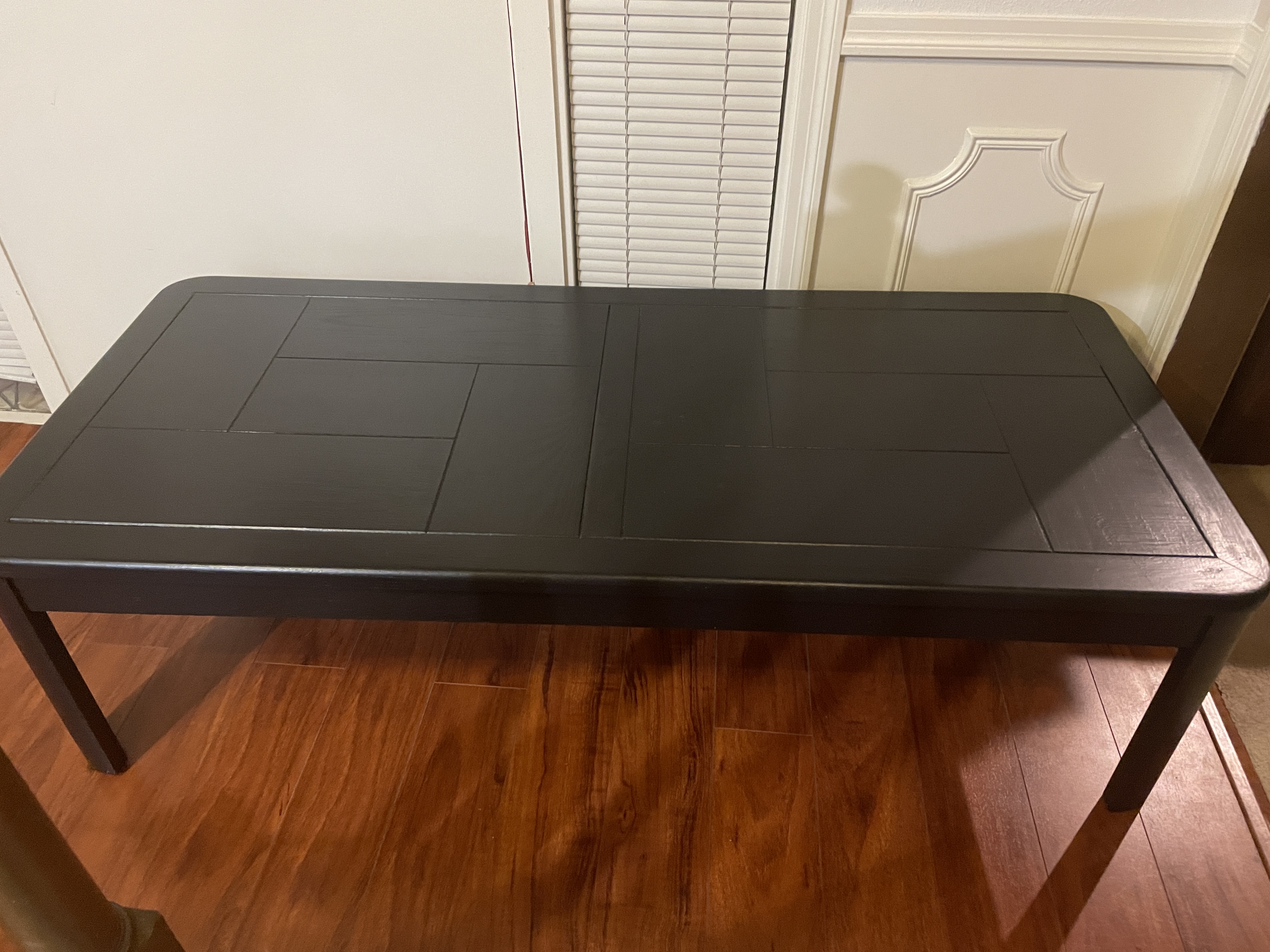 Black coffee table painted after quick and easy furniture makeover of dated brown curbside find table